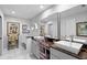 Bathroom featuring dual sinks, modern fixtures, and marble flooring at 1552 Covered Bridge Dr, Deland, FL 32724