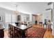 Elegant dining room with hardwood floors, a chandelier, and plantation shutters at 1552 Covered Bridge Dr, Deland, FL 32724