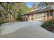 Brick home showcasing a two-car garage, side entry door, and well-maintained landscaping at 1552 Covered Bridge Dr, Deland, FL 32724