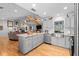 Bright kitchen with stainless steel appliances, farmhouse sink and light gray cabinets at 1552 Covered Bridge Dr, Deland, FL 32724