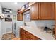Functional laundry room with washer, dryer, sink, and storage cabinets at 1552 Covered Bridge Dr, Deland, FL 32724