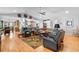Open living room concept with hardwood floors, fireplace, and comfortable seating area at 1552 Covered Bridge Dr, Deland, FL 32724