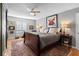 Comfortable main bedroom with a ceiling fan, large rug, and gray walls at 1552 Covered Bridge Dr, Deland, FL 32724