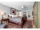 Bright main bedroom with a ceiling fan, neutral colors, and antique armoire at 1552 Covered Bridge Dr, Deland, FL 32724