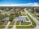 This home is an aerial shot with manicured lawn and an attached one car garage in a quiet neighborhood at 1579 Brady Dr, Deltona, FL 32725