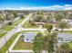 Aerial view of a home with a fenced yard in a lush, green neighborhood at 1579 Brady Dr, Deltona, FL 32725