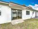 Exterior view of home with sliding glass doors and a patio at 1579 Brady Dr, Deltona, FL 32725