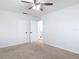Bedroom showcasing plush carpeting, a ceiling fan, and access to an adjacent room at 1579 Brady Dr, Deltona, FL 32725