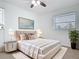 Comfortable bedroom featuring neutral tones, an area rug, and natural light from the windows at 1579 Brady Dr, Deltona, FL 32725