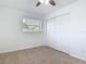 Light-filled bedroom featuring a ceiling fan, window, and a closet for ample storage at 1579 Brady Dr, Deltona, FL 32725