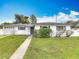 Charming one-story home featuring a well-manicured lawn and an attached one car garage at 1579 Brady Dr, Deltona, FL 32725