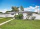 Charming one-story home featuring a well-manicured lawn and an attached one car garage at 1579 Brady Dr, Deltona, FL 32725