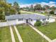 Charming one-story home featuring a well-manicured lawn and an attached one car garage at 1579 Brady Dr, Deltona, FL 32725