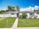 Charming one-story home featuring a well-manicured lawn and an attached one car garage at 1579 Brady Dr, Deltona, FL 32725