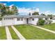 Charming one-story home featuring a well-manicured lawn and an attached one car garage at 1579 Brady Dr, Deltona, FL 32725