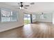 Bright living room features wood-look floors, and sliding glass doors to the yard at 1579 Brady Dr, Deltona, FL 32725