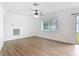 Bright living room features sleek wood-look floors, and a sliding glass door at 1579 Brady Dr, Deltona, FL 32725