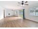 Open-concept living room features sleek wood-look floors and bright natural light at 1579 Brady Dr, Deltona, FL 32725