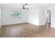 Living room features sleek wood-look floors and a bright sunny window at 1579 Brady Dr, Deltona, FL 32725