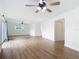 Spacious living room with sleek wood-look floors and bright natural light at 1579 Brady Dr, Deltona, FL 32725