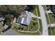 Aerial view showcases a fenced pool, large backyard, mature trees, and proximity to the neighborhood street at 1590 N Page Dr, Deltona, FL 32725