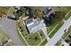 Aerial shot showcases a home with a screened pool, landscaped yard, and neighborhood surroundings at 1590 N Page Dr, Deltona, FL 32725
