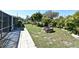 Manicured backyard features a lush lawn and brick firepit, ready for entertaining at 1590 N Page Dr, Deltona, FL 32725