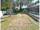 Spacious backyard with rock area between shed and screened-in pool offers room to relax and entertain at 1590 N Page Dr, Deltona, FL 32725