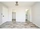 Bedroom featuring wood-look flooring, walk-in closet, and an ensuite bathroom at 1590 N Page Dr, Deltona, FL 32725