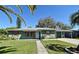 Beautiful single-story home featuring neutral green paint, decorative shutters, and an attached carport at 1590 N Page Dr, Deltona, FL 32725