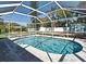 Refreshing screened pool area with a clean pool, comfortable seating, and lush landscaping at 1590 N Page Dr, Deltona, FL 32725