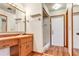 Bathroom featuring a vanity and a walk-in shower with tiled walls at 1651 Kenlyn Dr, Longwood, FL 32779