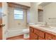 Bathroom featuring a tub, toilet, window, vanity, and tiled walls at 1651 Kenlyn Dr, Longwood, FL 32779