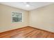 Simple bedroom with a ceiling fan and natural light from a bright window at 1651 Kenlyn Dr, Longwood, FL 32779