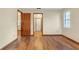Bedroom with laminate flooring, a window and two door ways at 1651 Kenlyn Dr, Longwood, FL 32779