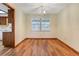 Dining room with hardwood floors and natural light from a bright window at 1651 Kenlyn Dr, Longwood, FL 32779