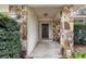 Inviting front entrance with stone accents and a covered porch at 1651 Kenlyn Dr, Longwood, FL 32779