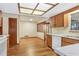 Well-lit kitchen with white appliances, wood cabinets, and an airy feel at 1651 Kenlyn Dr, Longwood, FL 32779
