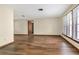 Spacious living room features hardwood floors and natural light from large windows at 1651 Kenlyn Dr, Longwood, FL 32779