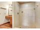 Shower stall with tiled walls and floors, and a chrome shower head at 1651 Kenlyn Dr, Longwood, FL 32779