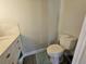 Bathroom featuring modern vinyl flooring and a standard toilet at 2235 Rabenton Rd, Deltona, FL 32738