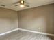 A bedroom featuring stylish wood-look flooring and a ceiling fan at 2235 Rabenton Rd, Deltona, FL 32738