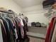 Walk-in closet with built-in shelving and organized storage solutions at 2235 Rabenton Rd, Deltona, FL 32738