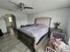 A spacious main bedroom with a ceiling fan and luxury vinyl plank flooring at 2235 Rabenton Rd, Deltona, FL 32738