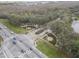 A stunning aerial view of the community entrance highlighting its lush landscaping and serene atmosphere at 232 Gala Cir, Daytona Beach, FL 32124
