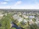 Picturesque aerial view of a residential neighborhood with pond and lush greenery at 232 Gala Cir, Daytona Beach, FL 32124