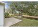 Relaxing backyard view with mature trees and serene water feature at 232 Gala Cir, Daytona Beach, FL 32124