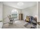 Cozy bedroom with large arched window and neutral walls at 232 Gala Cir, Daytona Beach, FL 32124