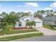 Charming single-story home with well-manicured lawn and mature landscaping at 232 Gala Cir, Daytona Beach, FL 32124