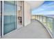 Large balcony with glass railings providing stunning views of the water and cityscape at 241 Riverside Dr # 1502, Daytona Beach, FL 32117